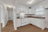 There's lots of Kitchen Cabinets and Counterspace.