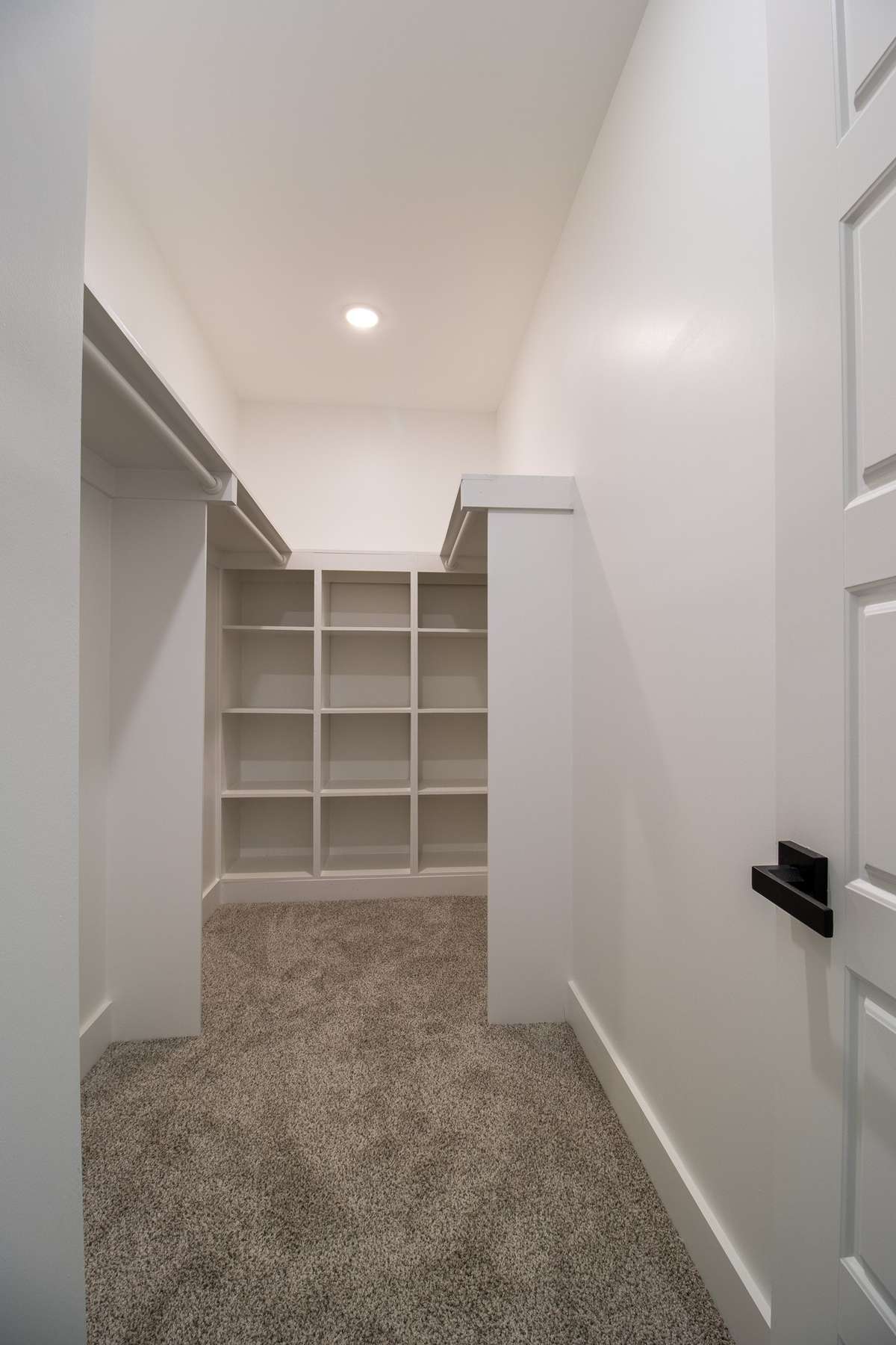 With custom built-in shelving, the primary closet is ready to be filled!