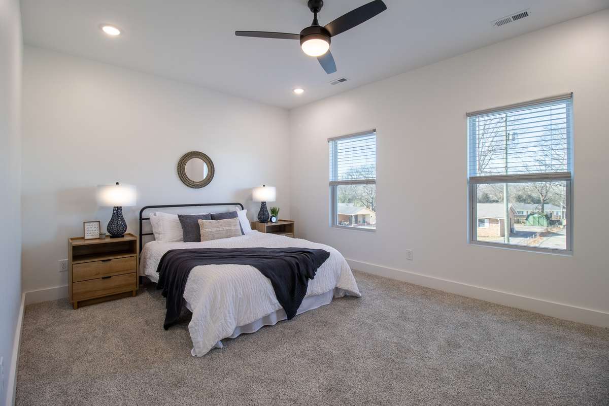 The primary suite boasts plenty of space and lots of natural light.