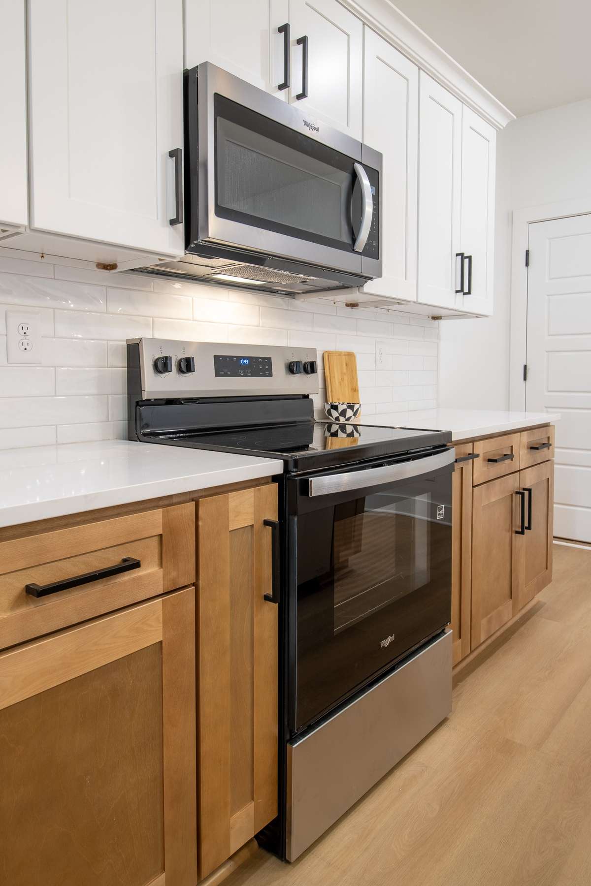 Crisp White quartz and modern matte black accents complete the look.