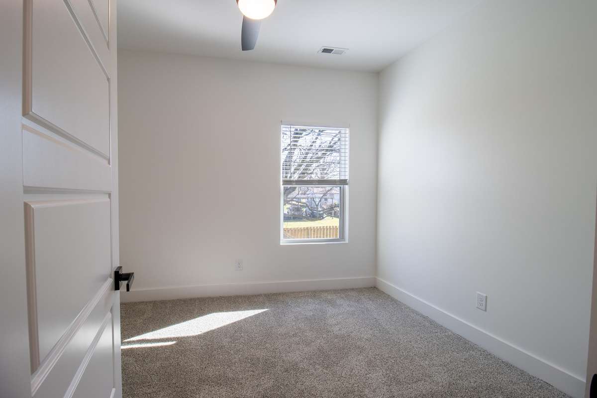 The secondary bedrooms are warm and inviting.