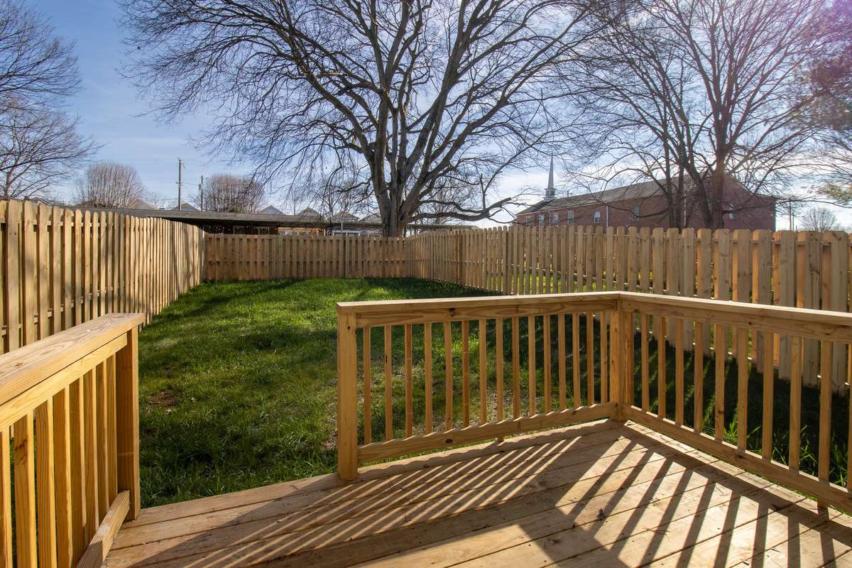 A deck that extends into the privacy-fenced backyard is the perfect place for relaxing or entertaining.