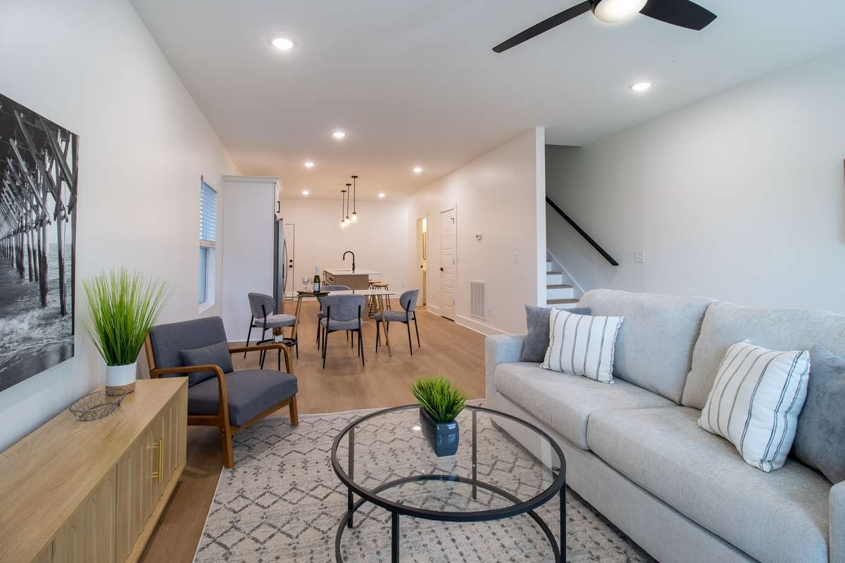 An open-concept living area overlooks the back yard.