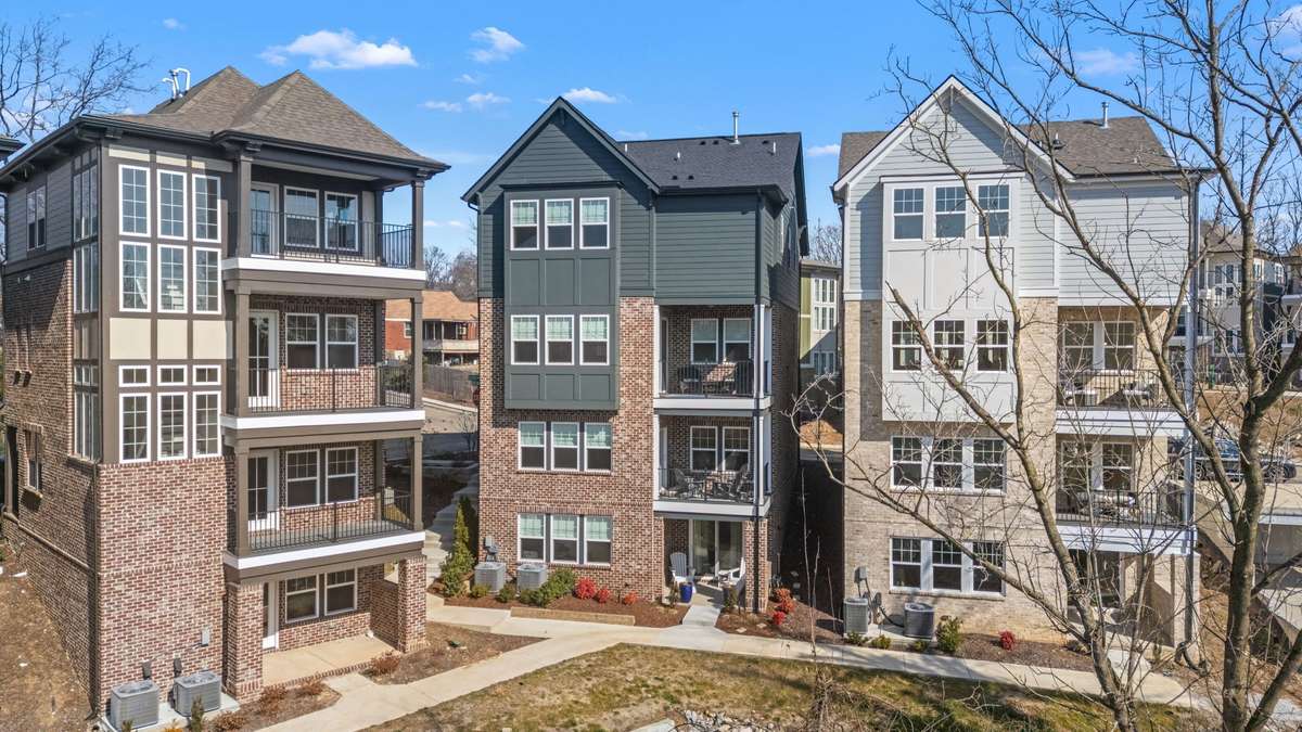 View of the back of the home featuring the covered balconies/patio!