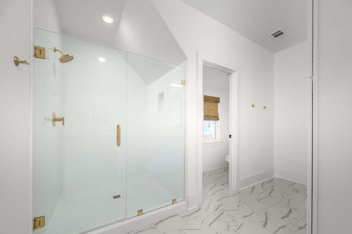 Spa-like bathroom servicing guest room on the 4th floor.  Huge walk-in shower, private water closet, and a dual sink vanity with storage!