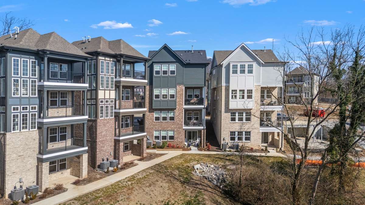 View of the back of the home featuring the covered balconies/patio!