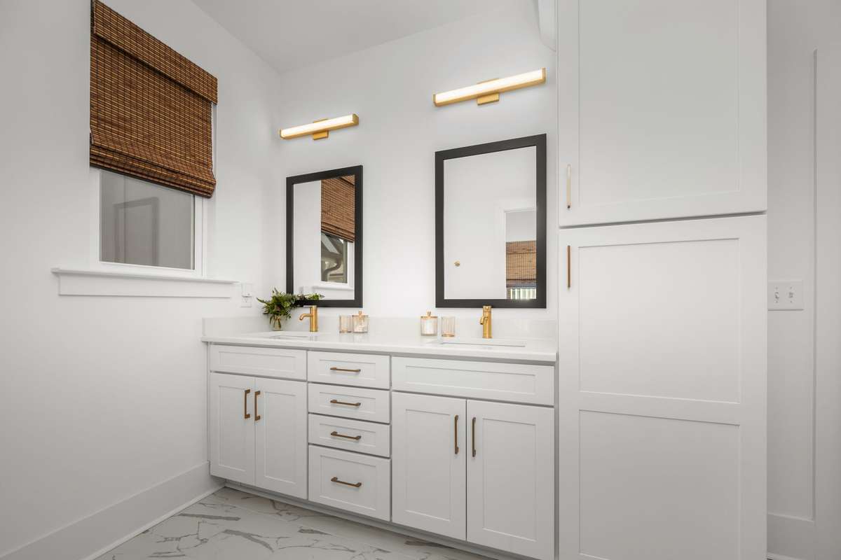 Spa-like bathroom servicing guest room on the 4th floor.  Huge walk-in shower, private water closet, and a dual sink vanity with storage!