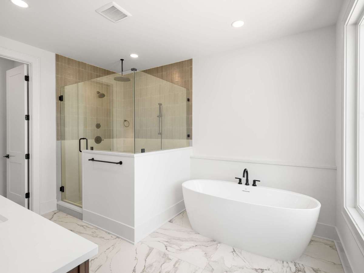 Huge primary bath with soaking tub, oversized shower, water closet and double vanity
