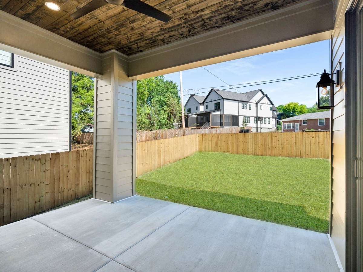 Spacious covered porch overlooking your very large fenced in yard