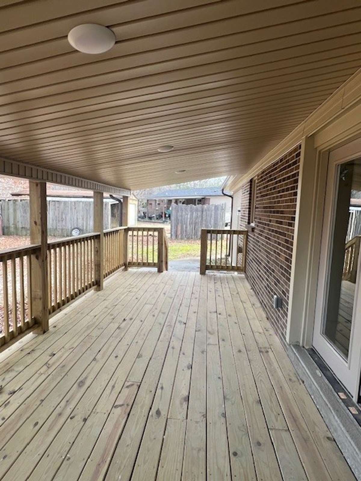 Spacious covered back porch perfect for entertaining.