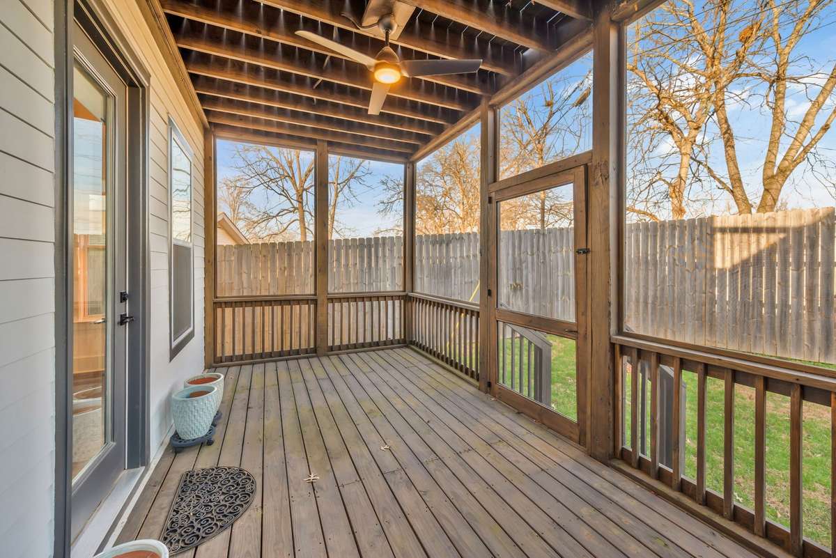 Screened Porch Spans the back of the Home overlooks the Fenced Backyard
