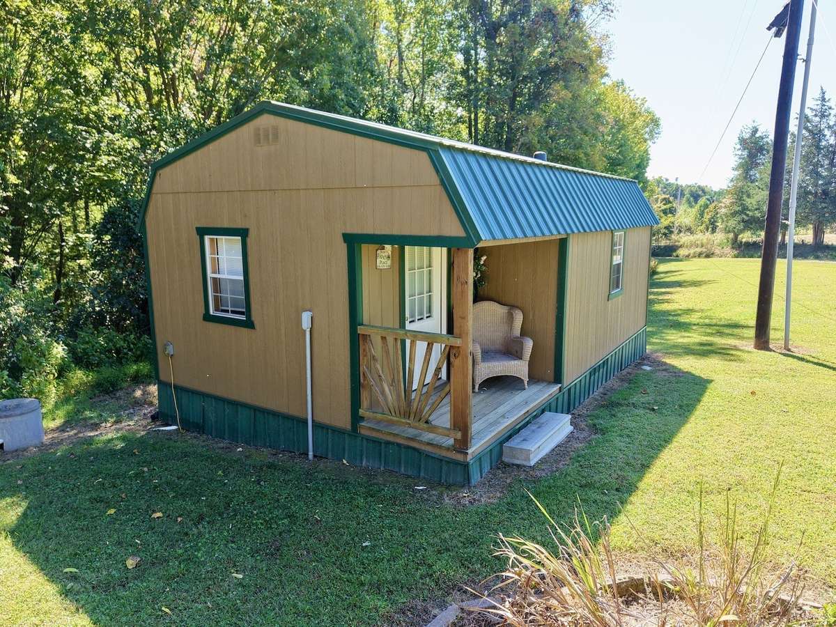 Separate finished structure for guesthouse, studio or office! Connected to septic, water, electric & has mini split HVAC!