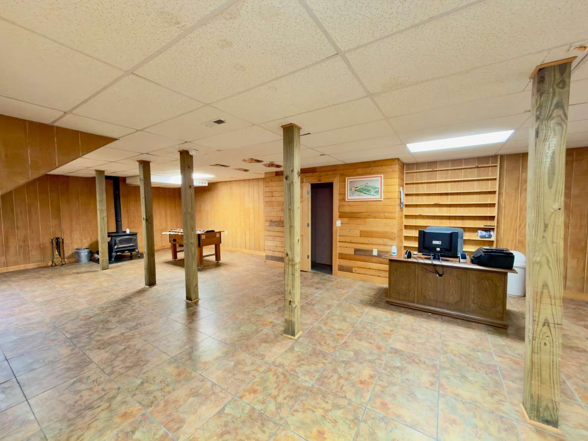 Finished full basement with wood stove for emergency heat back-up.