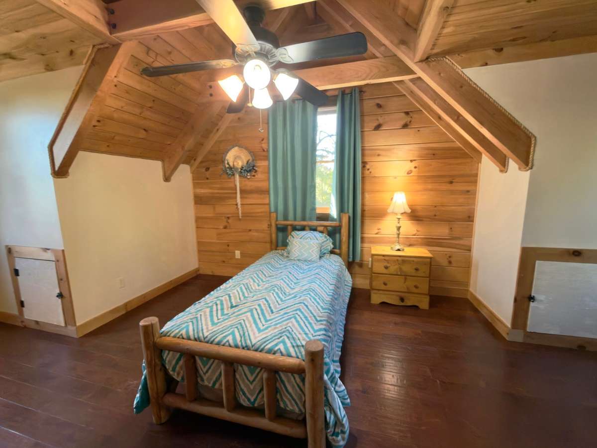 2nd Upstairs bedroom.  Closet, hidden storage and 3 windows for natural lighting.