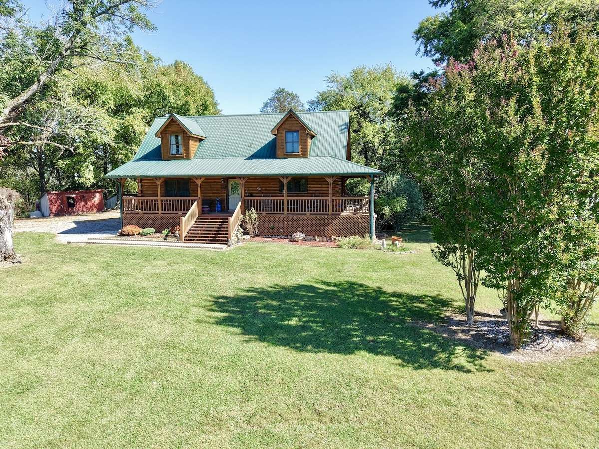 2210 Old Prospect Rd Woodbury TN.  Custom Log Home built in 2009 with barns, sheds and 47.58 acres.