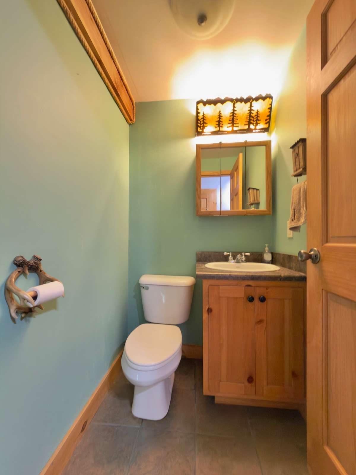 Half bath in entry foyer.