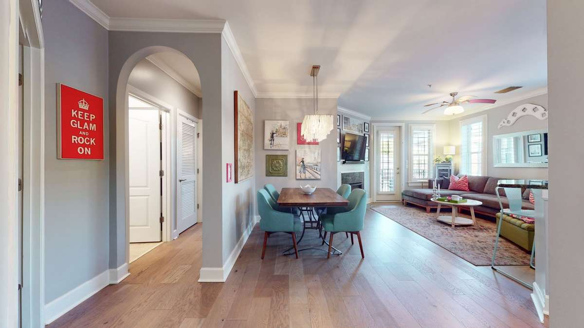 The open-concept layout features granite countertops, a breakfast bar, and freshly painted kitchen