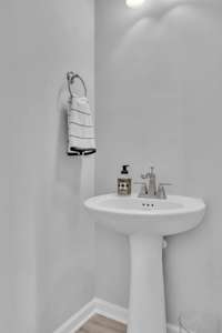 Powder Room/Half Bath located downstairs beside Laundry Room.