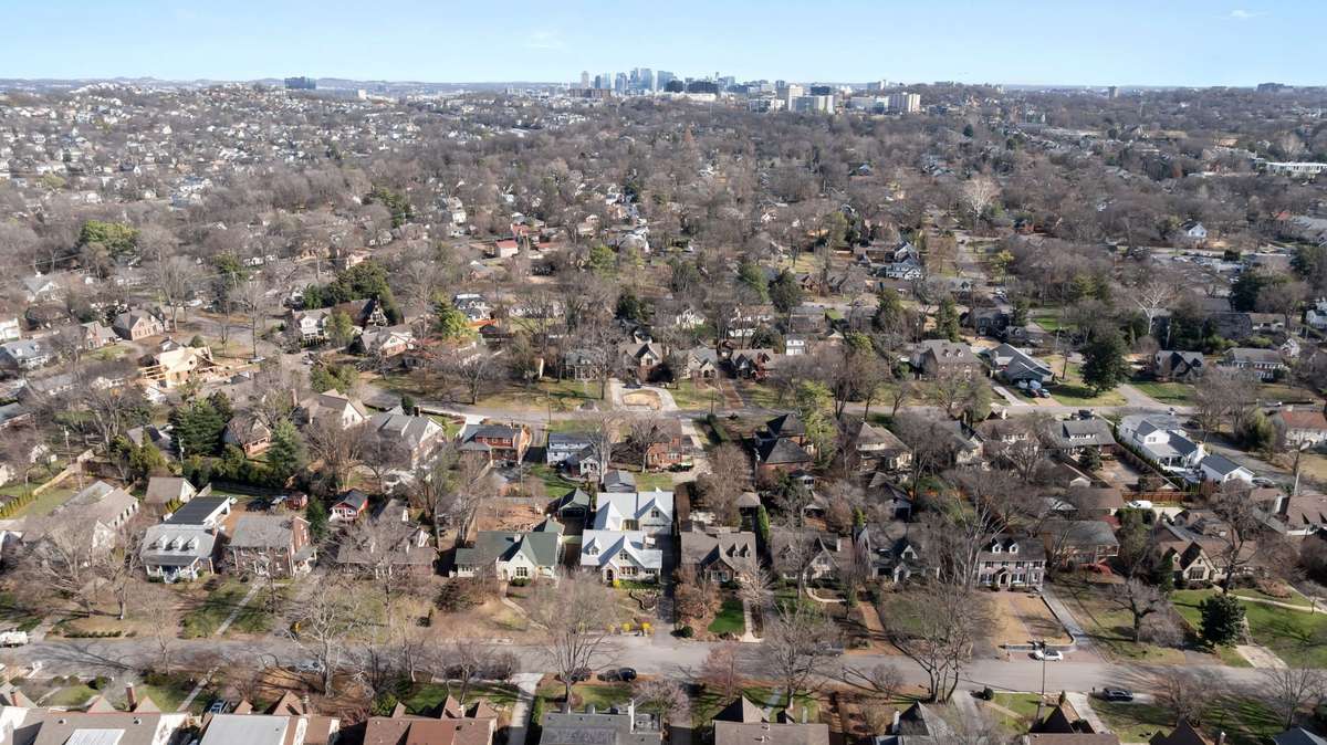Drone photography shows the home's prime location, near to downtown but tucked away in a cozy, historic overlay.
