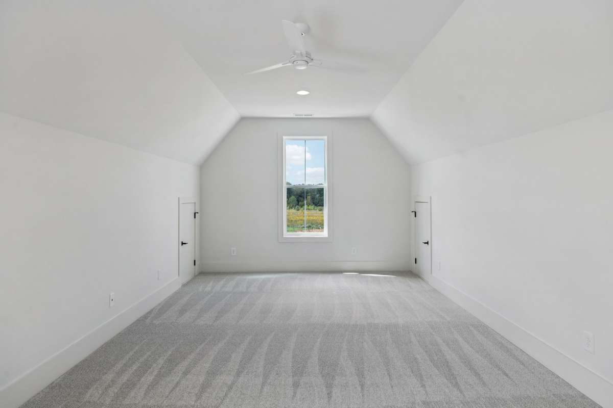 Upstairs Bonus Room includes a plush carpet flooring and option of fan or featured light fixture