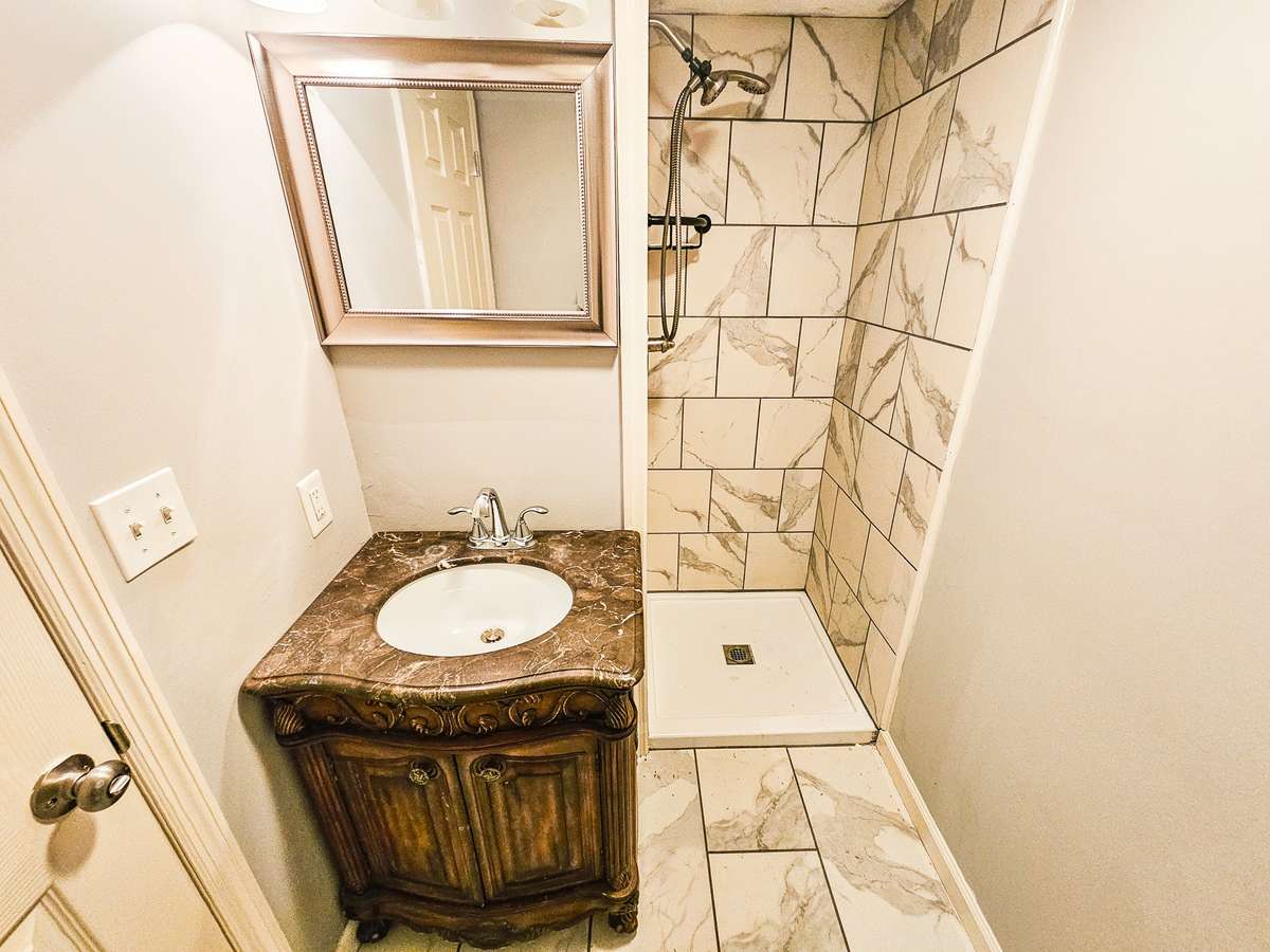 Master Bath has a tiled shower. Nice newer vanity.