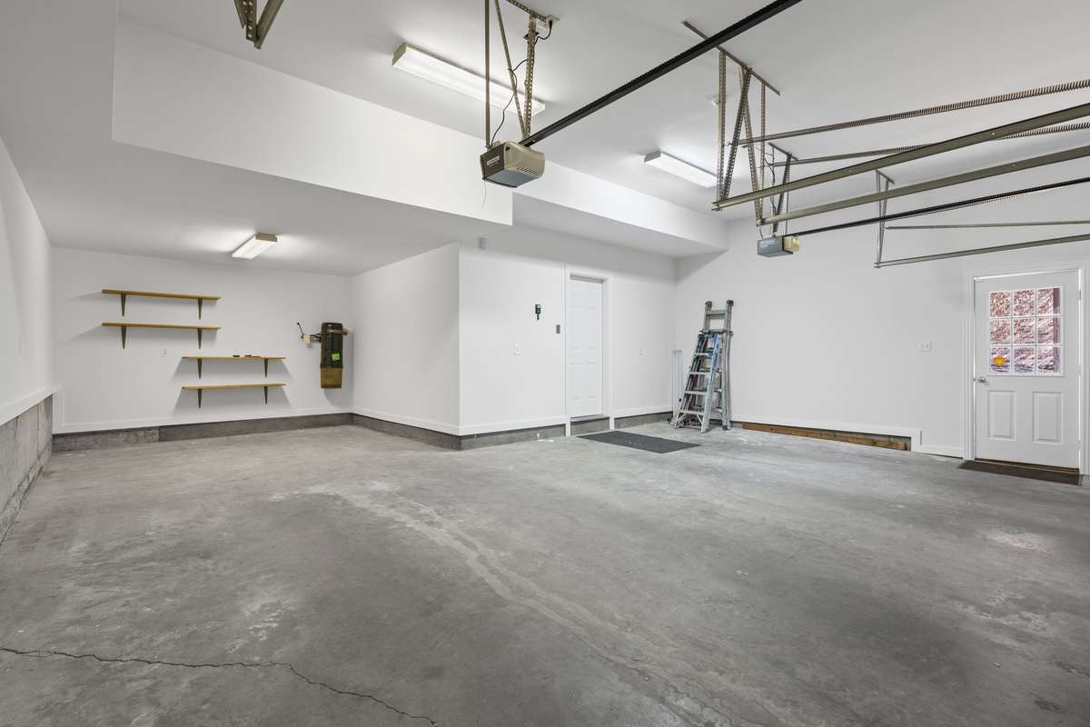 Large spotless garage! Room for 2 cars plus work area