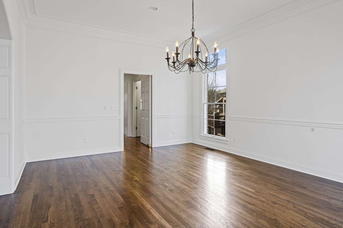 Look at these gorgeous floors. Dining room leading to butlers pantry and large pantry, floor to ceiling windows