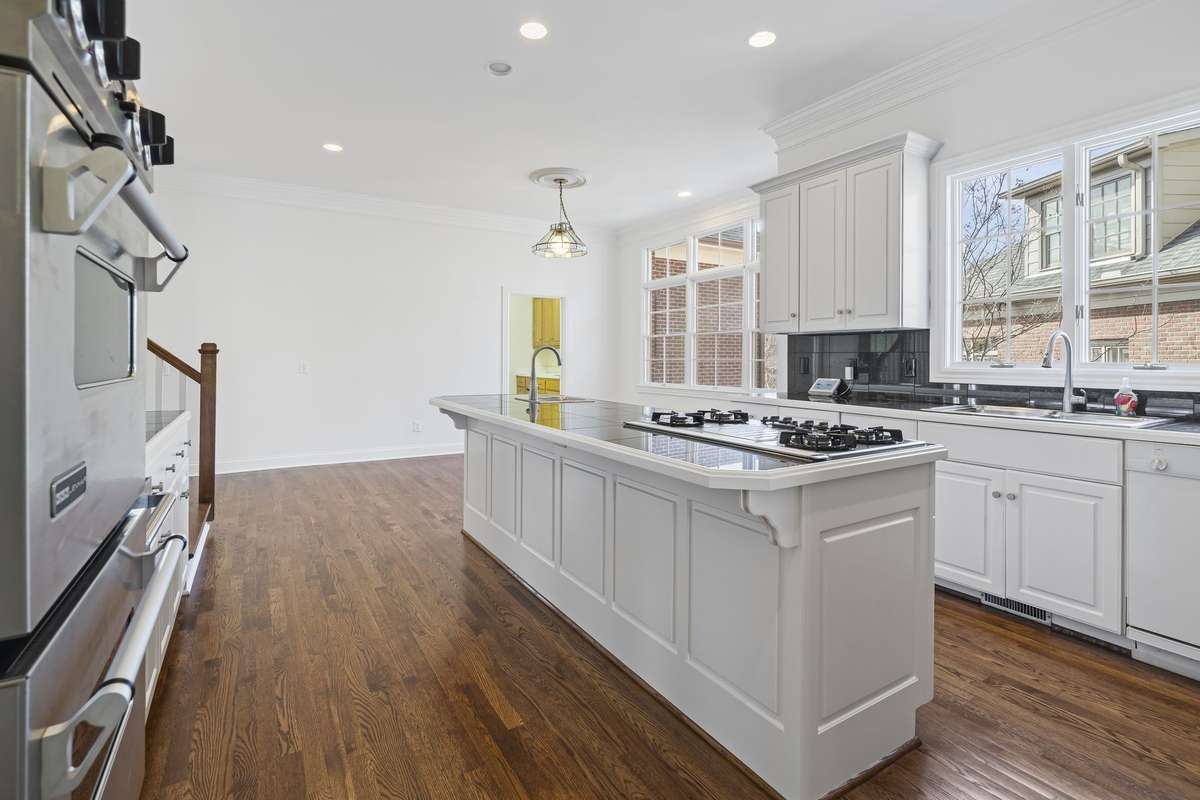 Large light-filled kitchen with island.