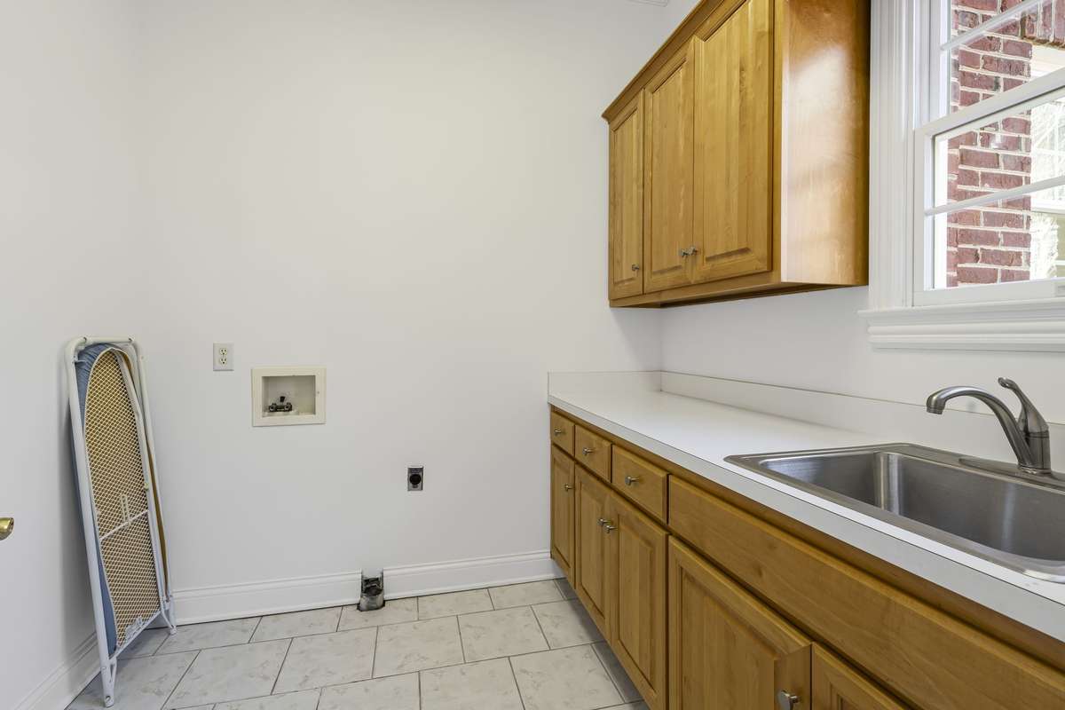 Laundry with plenty of room and a sink for soaking those stains!