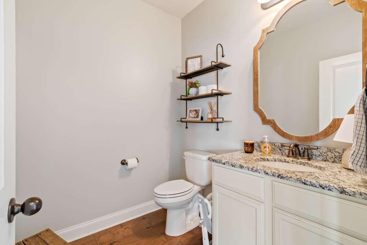 The half bathroom is conveniently located on the main floor, right off of the living room.