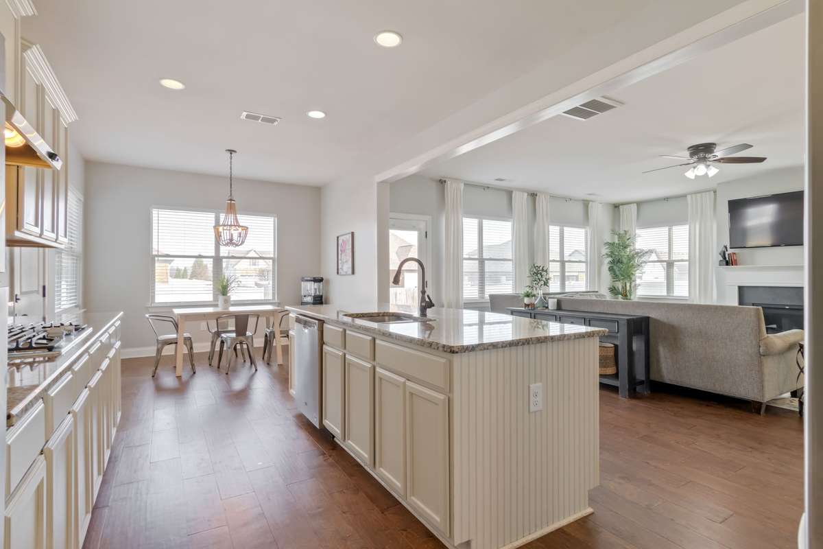 This picture captures the beautiful windows that grace the rear of the home. Fall in love with all of this natural light.