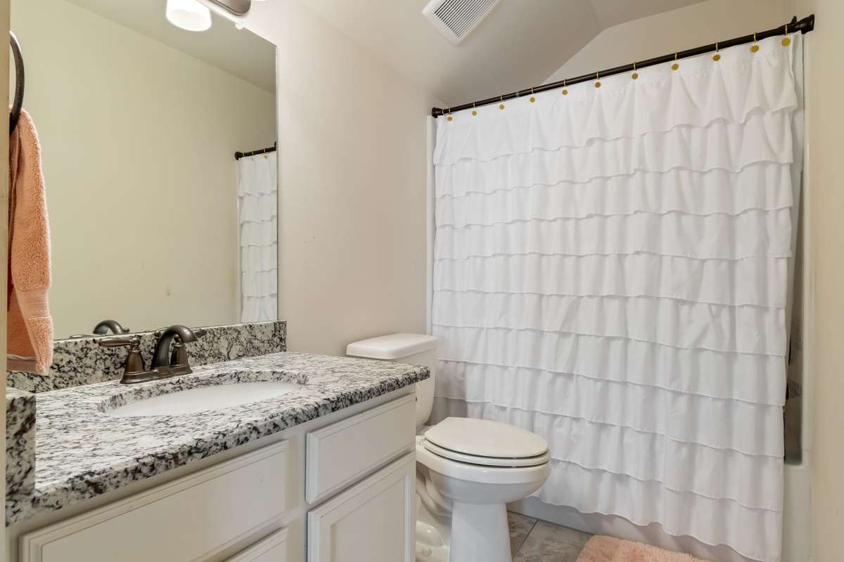 The third full bathroom is also located on this floor right next to the fifth bedroom. Such a great spot for someone wanting a private space.