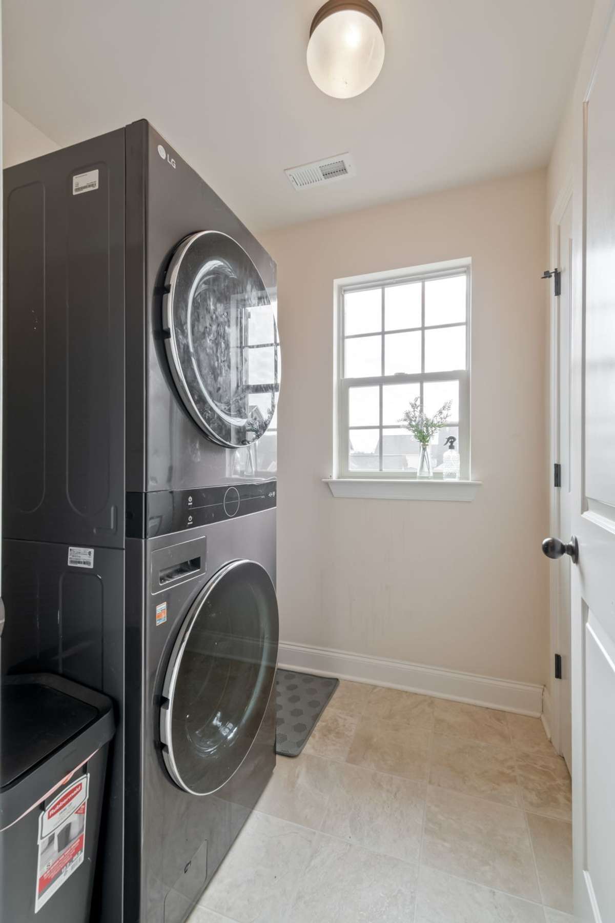 The laundry room is conveniently located on this second floor at the end of the hallway.