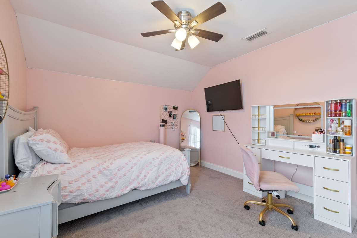 There is a spacious fifth bedroom located on this third floor. Perfect for a teen suite or multigenerational living.