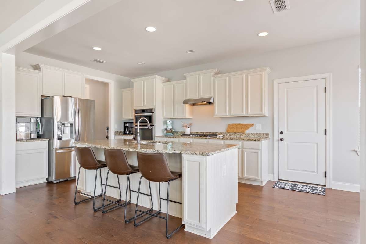 Another view of this lovely kitchen. The door pictured here leads out to the two car garage.