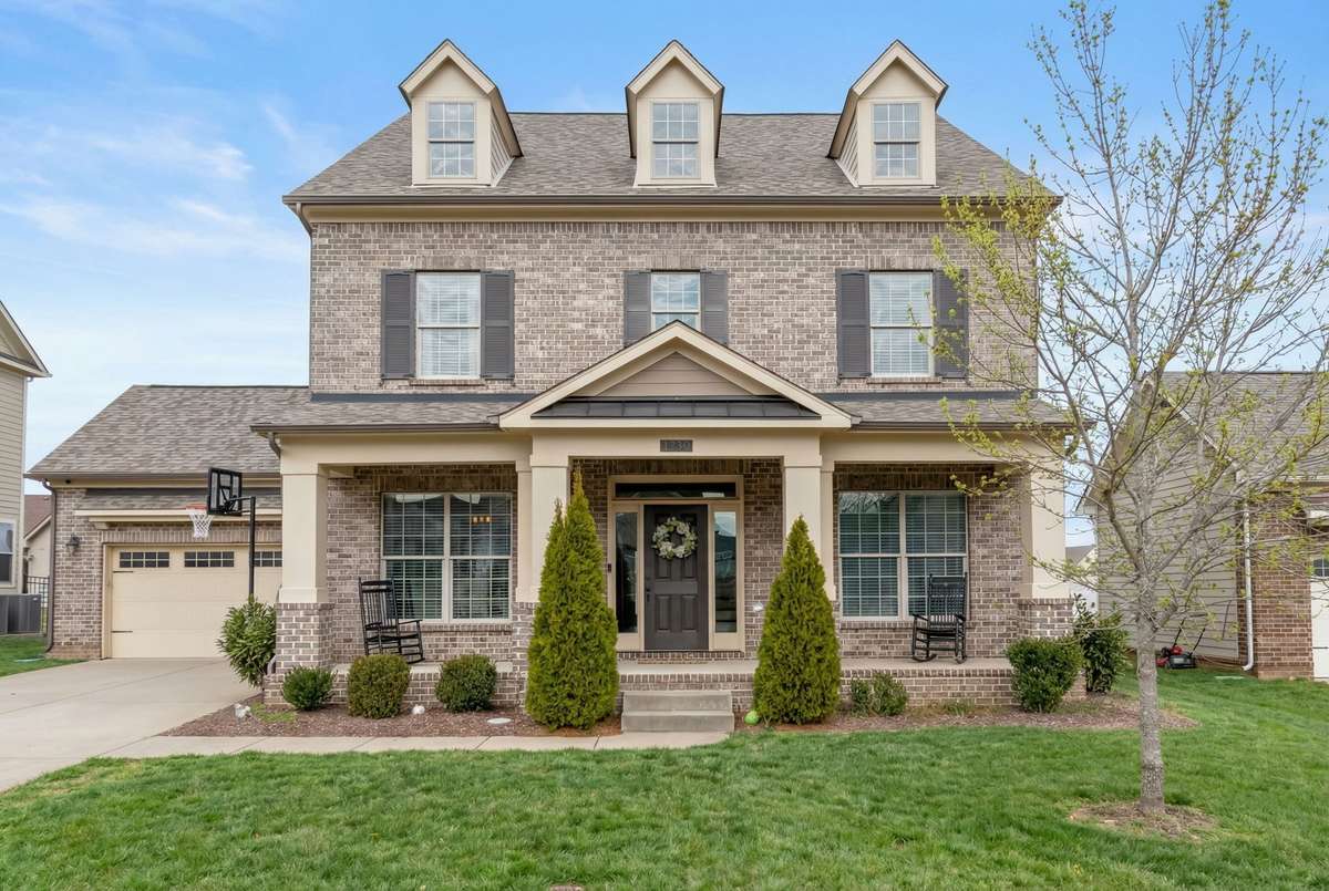 This spacious brick home is located in the Brighton Park subdivision. This photo has been embellished to show the property in the spring season.