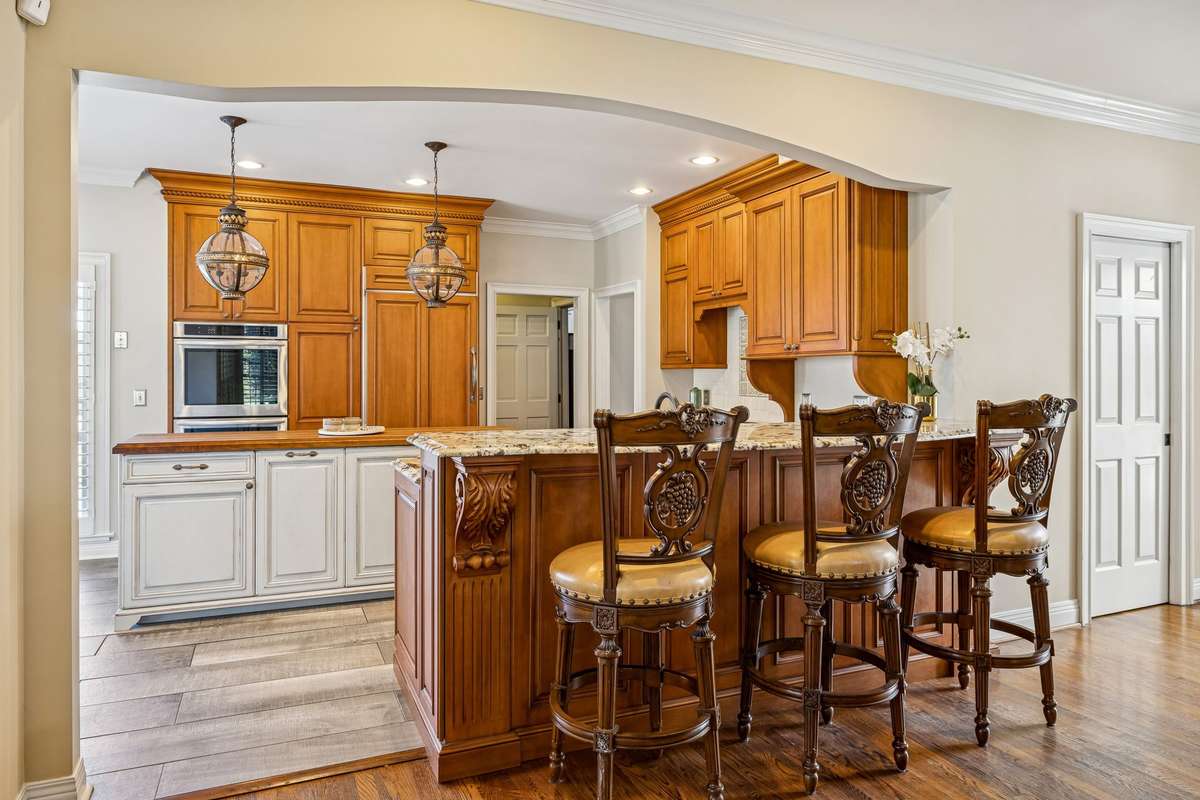 Look at the detail! This kitchen is a dream to cook in! You have a double oven with one being a convection oven. You have an appliance caddy, recycle, and trash pullouts.  The layout of these cabinets was intentional and well thought out.