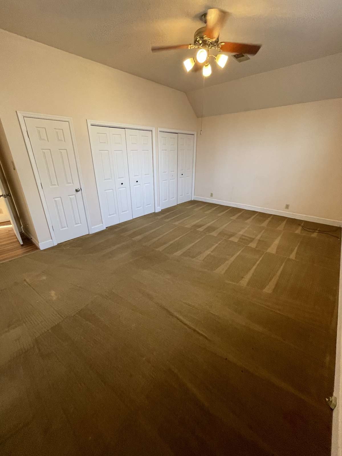 Master bedroom his and her closets and a coat closet