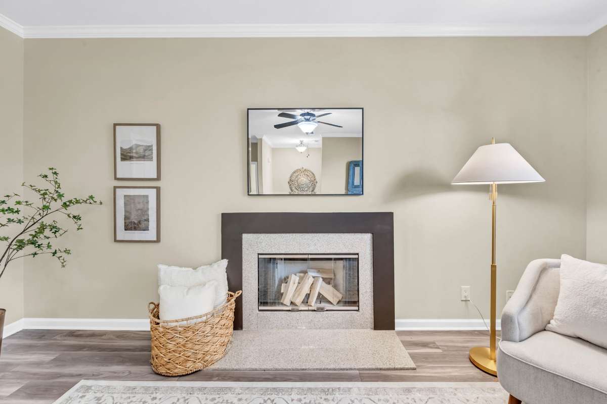 The fireplace is surrounded by beautiful granite