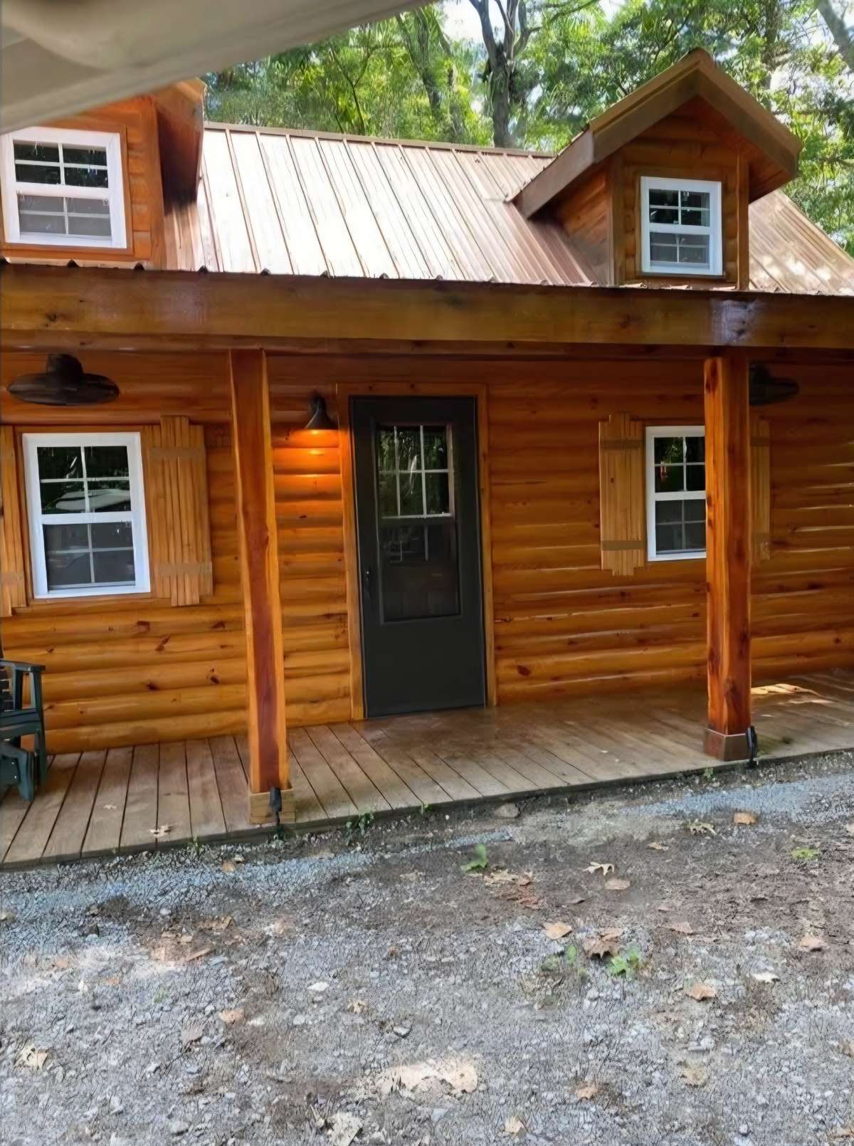 The Log Cabin in the Woods has a Living Room, Kitchen, Bedroom and Full Bath!  
Private Retreat for Visiting Family!
