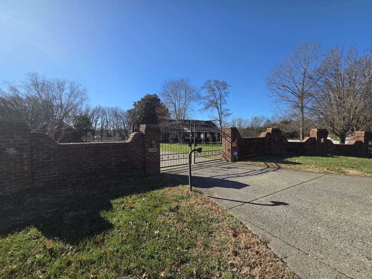 Impressive Brick Entrance with Security Gate.