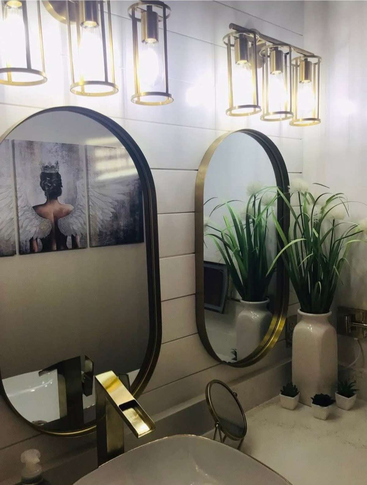 Updated Mirrors and Lighting Fixtures in Bathrooms.