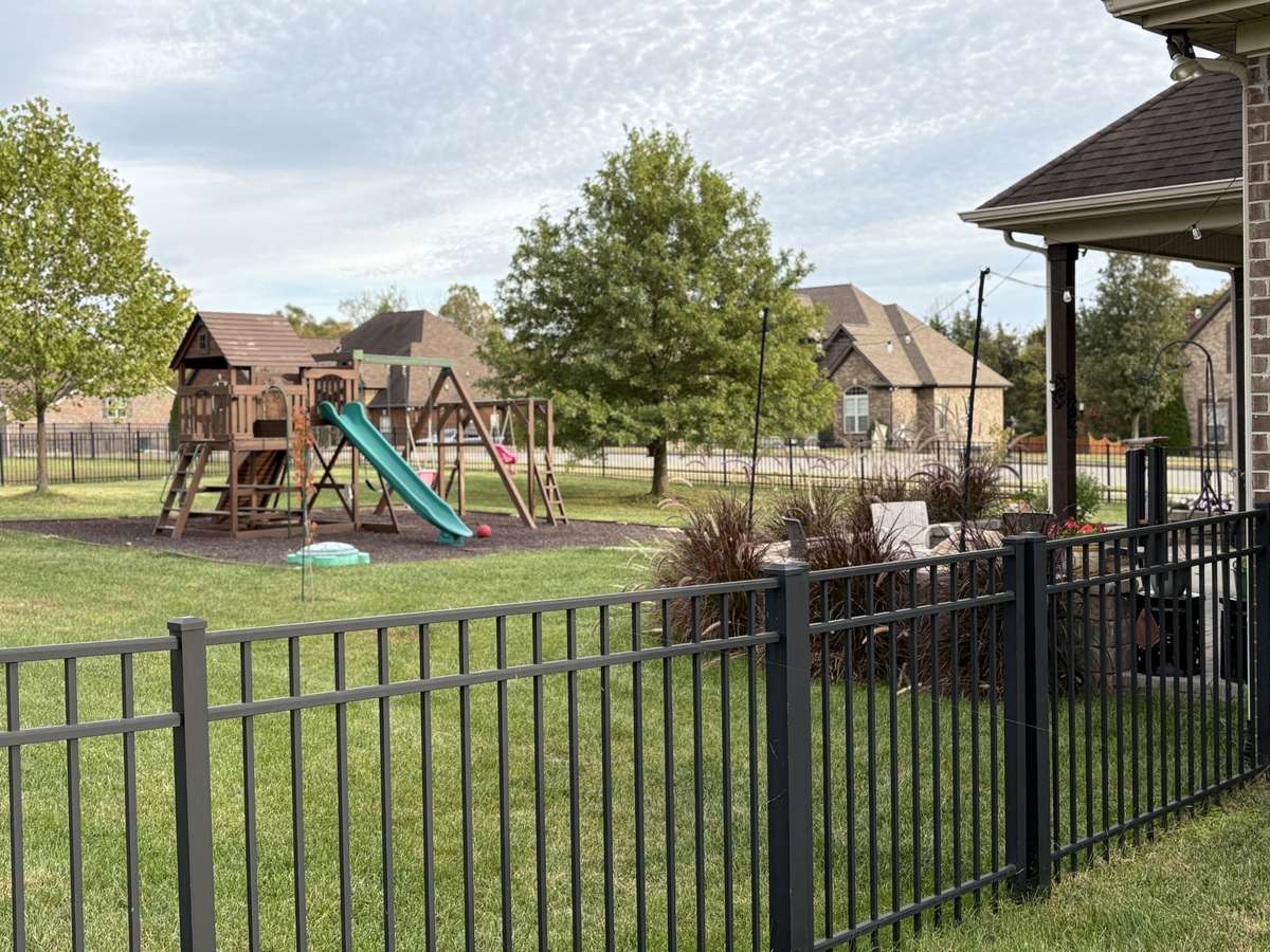Back patio has been extended for extra seating and a fire pit. Fenced back yard allows room for family fun.