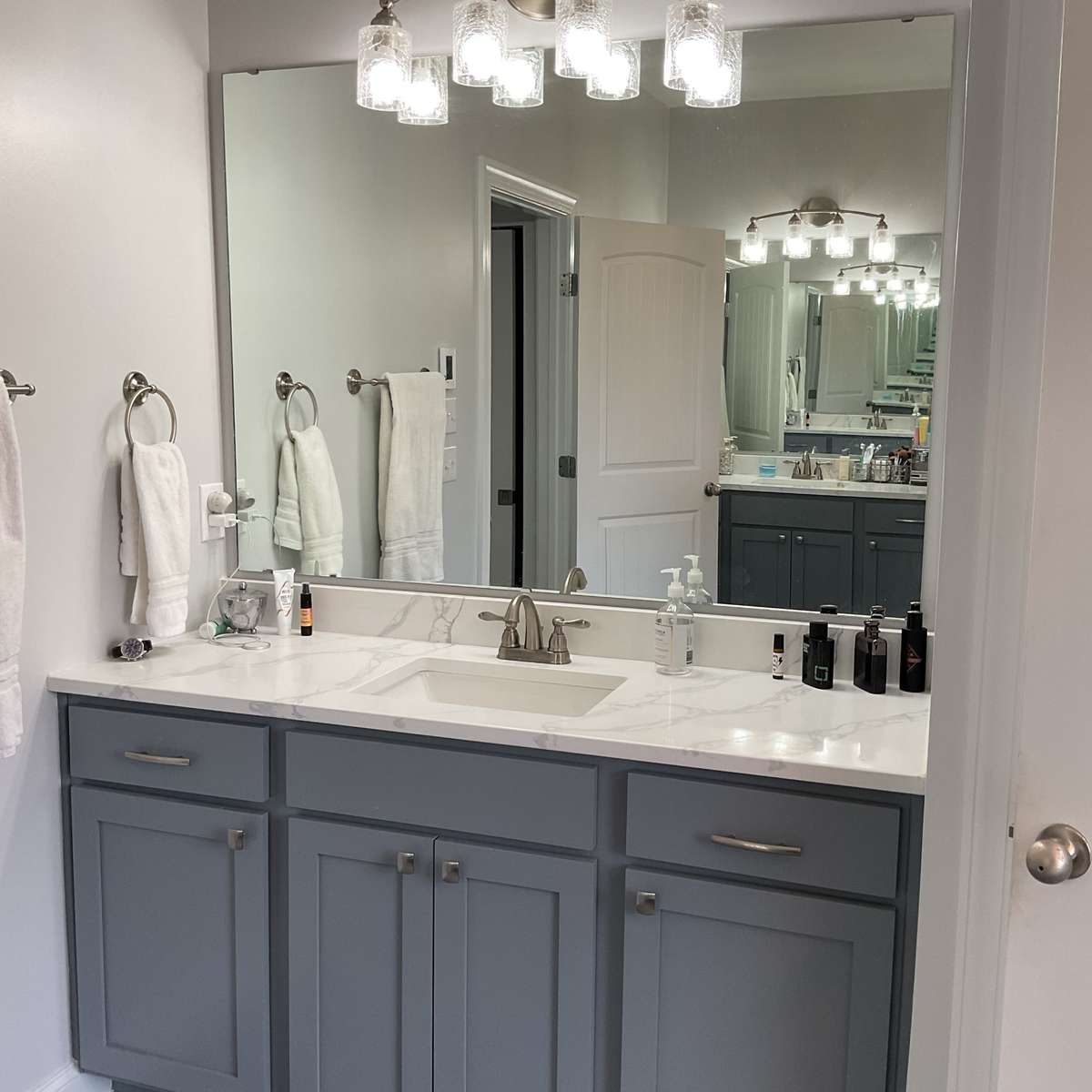 Large primary bath, with heated floors, has two separate vanities.