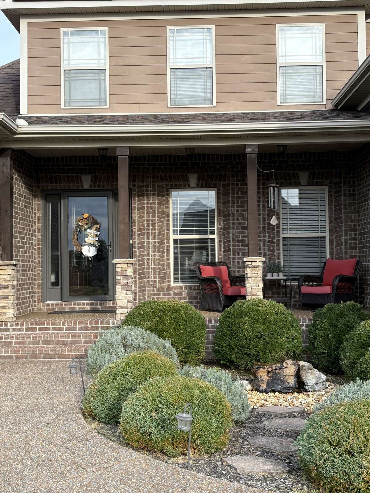 Front porch overlooks a bubbling water feature.