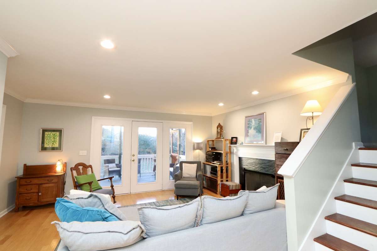 Stairs go to the next level which features a bedroom, utility room and a den.