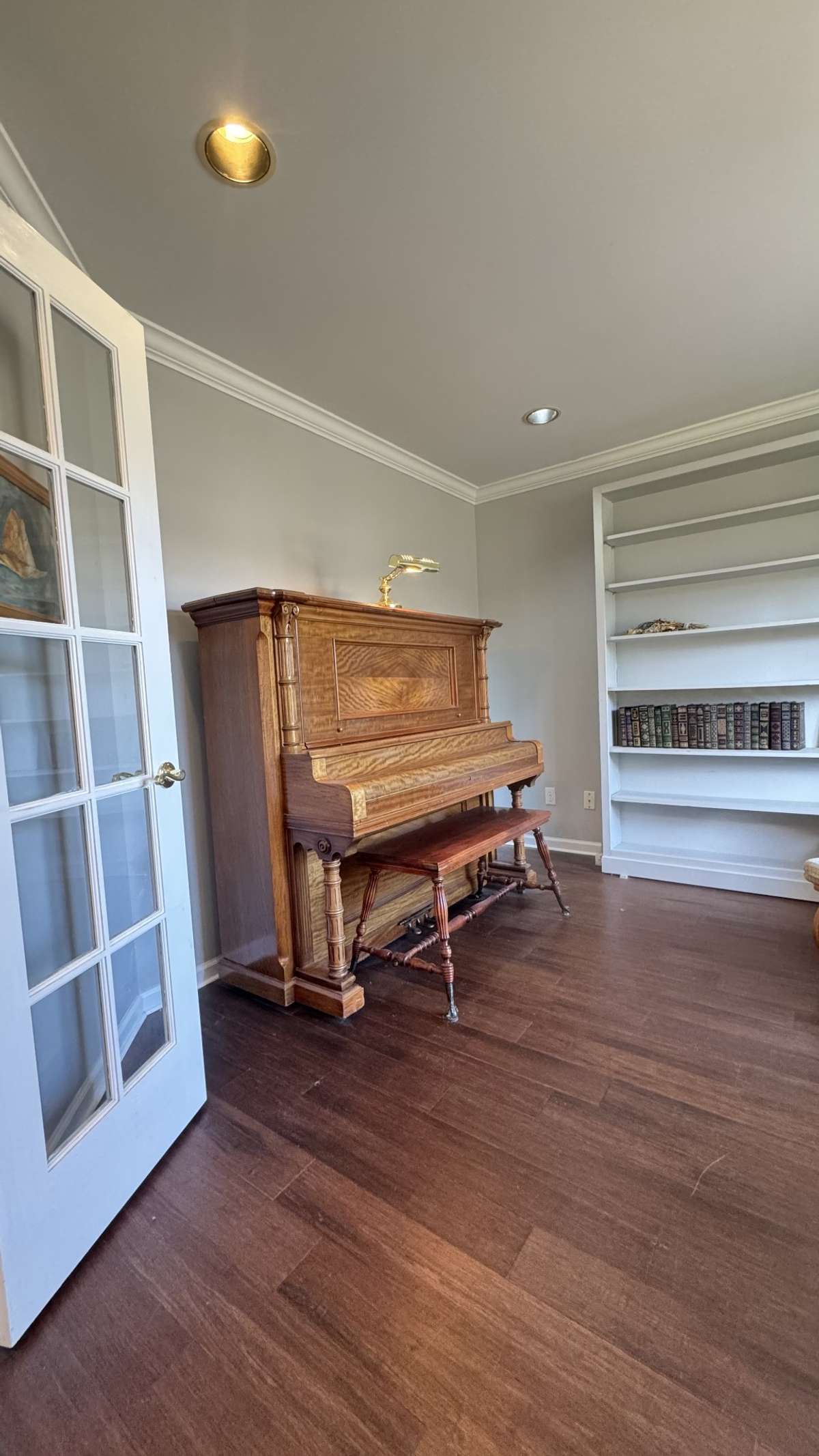 Office is at front of home with French doors.
