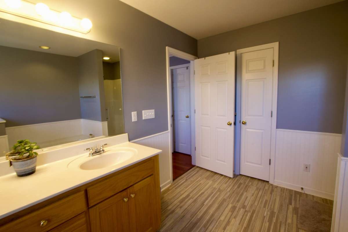 Primary bath has a shower and a garden tub.