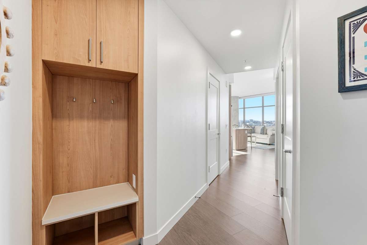 Welcoming entry with built-in storage, hooks + bench—perfect for everyday ease.