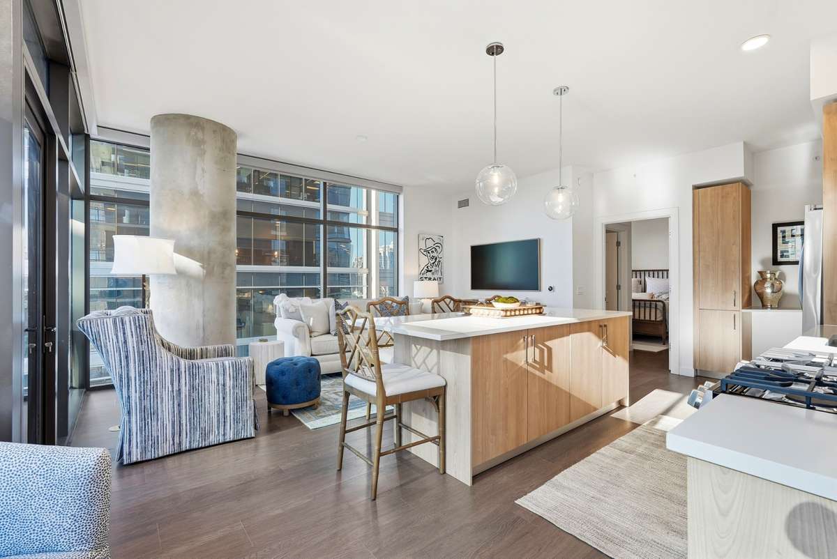 A bright corner residence made for entertaining—wrapped in glass with stunning city views.